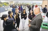  ?? CHARLIE NEUMAN FOR THE SAN DIEGO UNION-TRIBUNE ?? Mission Hills High Principal Cliff Mitchell speaks to students at a Future Center event Thursday.