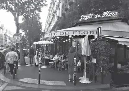  ?? Associated Press ?? ABOVE: Cafe de Flore is shown on a busy afternoon in Paris. It’s the site where AfricanAme­rican novelist James Baldwin worked on his novel, “Go Tell It on the Mountain.” Travelers to Paris can create a different type of itinerary exploring...