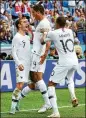  ?? ALEX LIVESEY / GETTY IMAGES ?? Raphael Varane of France celebrates a score last week with Kylian Mbappe and Antoine Griezmann in Nizhny Novgorod, Russia.