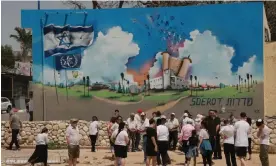  ?? Photograph: Quique Kierszenba­um/The Guardian ?? Israelis visit the site of the destroyed police station in Sderot which was briefly taken over by Hamas gunmen on 7 October.