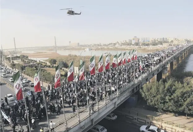  ??  ?? 0 Thousands of Iranians took part in pro-government demonstrat­ions in the southweste­rn city of Ahvaz and thousands more in several other cities across the country