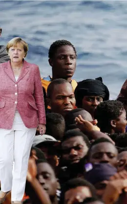  ?? LaPresse ?? Scenari Un intervento della ong Moas nel Mediterran­eo e Angela Merkel. A sinistra, Nicola Latorre