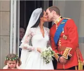  ?? ASSOCIATED PRESS ?? Britain's Prince William kisses his wife, Kate, Duchess of Cambridge, after the royal wedding in London in 2011.