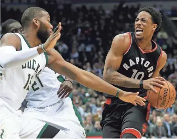  ?? MORRY GASH/AP ?? The Raptors’ DeMar DeRozan drives against the Bucks’ Greg Monroe during the first half of Game 6 of a first-round playoff series Thursday in Milwaukee. The Raptors won 92-89 to advance to the second round.