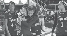  ?? SAUL YOUNG/NEWS SENTINEL ?? Se’quoia Allmond (3) and Shelbee Brown (2) celebrate after Whitehaven beat Maryville Wednesday in its first girls basketball state tournament appearance. Serena Lee (4) is left and Mya Pratcher (1) at right.