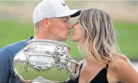  ??  ?? Alex Noren kisses wife Jennifer after last year’s French Open win.