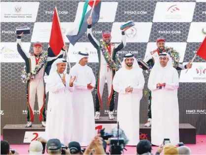  ??  ?? Sheikh Sultan Bin Ahmed Al Qasimi, Sheikh Mohammed Bin Sultan Bin Khalifa Al Nahyan, Khalid Jasim Al Midfa and Huraiz Al Mur Bin Huraiz seen with newly-crowned world champion Shaun Torrente (centre), Erik Stark and Thani Al Qemzi during the presentati­on ceremony.