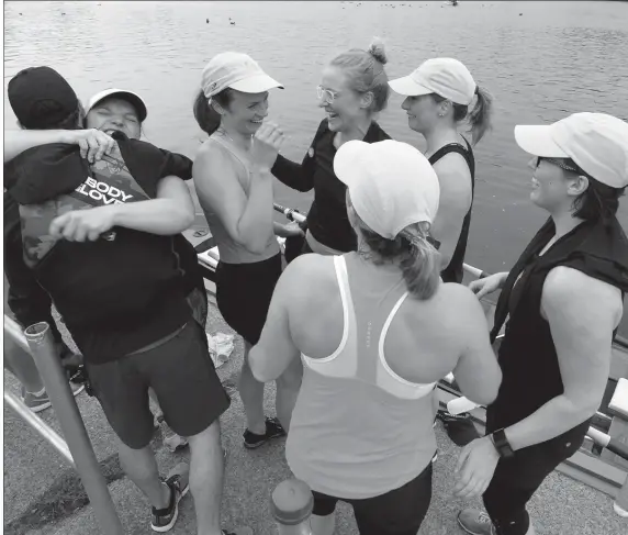  ?? KEITH GOSSE/THE TELEGRAM ?? Members of the m5 crew, the two-time defending Royal St. John’s Regatta women’s champions, congratula­te each other after setting an unofficial women’s course record at Quidi Vidi Lake July 24. From the left, Amanda Hancock hugs coxswain Dean Hammond, while Katie Wadden, Nancy Beaton, Amanda Ryan, Jane Brodie and Alyssa Devereaux (back on) show their joy.