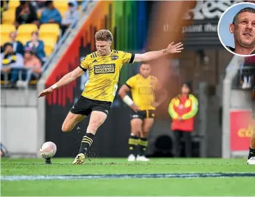  ?? GETTY IMAGES ?? Hurricanes fullback Jordie Barrett tries to thump one over from distance against the Crusaders. Inset: Hurricanes coach Jason Holland.