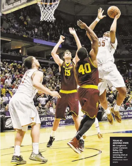  ?? JEFF HANISCH/USA TODAY SPORTS ?? Longhorns center Cameron Ridley (55) shoots the winning shot at the buzzer.