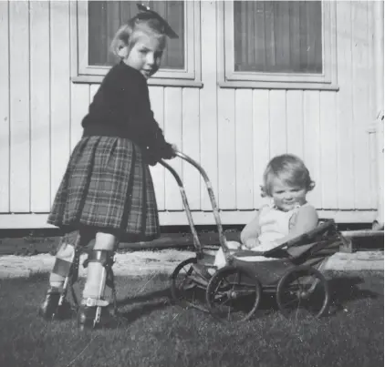  ??  ?? Kate Strohm being wheeled as an infant in her pram by her older sister Helen.