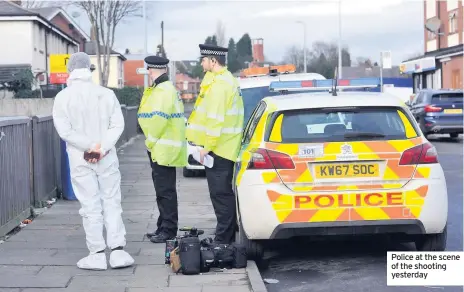  ??  ?? Police at the scene of the shooting yesterday