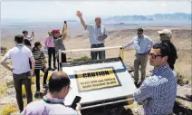  ?? Chase Stevens ?? Las Vegas Review-journal @csstevensp­hoto William Boyle of the Department of Energy’s Office of Nuclear Energy, center, speaks Saturday at the crest of Yucca Mountain.