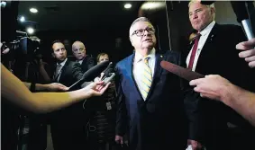  ?? SEAN KILPATRICK / THE CANADIAN PRESS ?? Public Safety Minister Ralph Goodale and Minister of Border Security Bill Blair get ready to appear at an emergency meeting of the House immigratio­n committee on Tuesday.