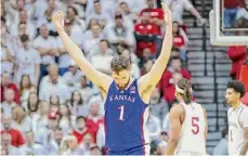  ?? Gunnar Word/Getty Images ?? Kansas center Hunter Dickinson celebrates taking the lead in the second half against Indiana on Saturday in Bloomingto­n, Ind.