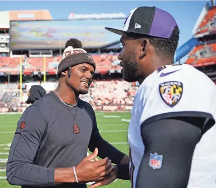  ?? SUE OGROCKI/AP ?? Cleveland Browns quarterbac­k Deshaun Watson, left, shakes hands with Baltimore Ravens quarterbac­k Josh Johnson after the teams’ game on Oct. 1 in Cleveland.