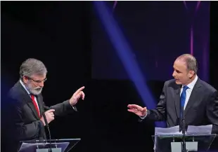  ??  ?? Forming a coalition with Sinn Féin and Gerry Adams could be the only way Micheál Martin can avoid leading Fianna Fáil back into the wilderness of the Opposition benches