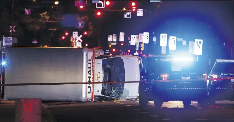  ?? IAN KUCERAK ?? Edmonton police rammed a speeding truck with a cruiser to end a truck attack on the night of Sept. 30, 2017, flipping it onto its side at 100 Avenue and 106 Street.