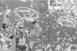  ??  ?? Kurt Busch celebrates in victory lane after winning his first Sprint Cup race of the season, the Toyota Owners 400 at Richmond Internatio­nal Raceway in Richmond, Va., on Sunday.