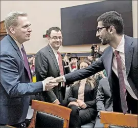  ?? Saul Loeb AFP/Getty Images ?? GOOGLE CHIEF Sundar Pichai, right, greets Rep. Kevin McCarthy (R-Bakersfiel­d) before testifying to lawmakers that Google’s search engine has no bias against conservati­ves. He didn’t rule out a censored search tool for China.