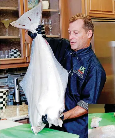  ?? [PHOTOS BY SARAH PHIPPS, THE OKLAHOMAN] ?? Delancey Miller, seafood specialist with US. Foods, breaks down fresh halibut at American Propane in Oklahoma City.