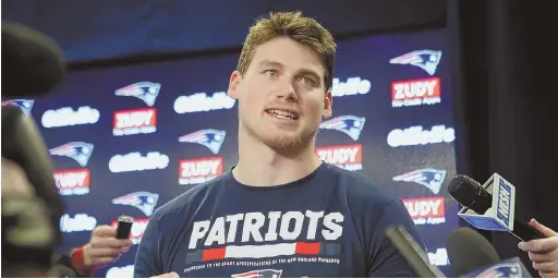  ?? STAFF PHOTO BY NANCY LANE ?? A REBIRTH IN FOXBORO: Troy Niklas meets the media yesterday at Gillette Stadium after the free agent tight end signed with the Patriots earlier this month. Niklas and his wife, Chloe, also have welcomed the couple’s first child.