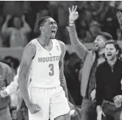  ?? Karen Warren / Staff photograph­er ?? Houston guard Armoni Brooks exults after his 3-pointer put the Cougars on top in the second half.