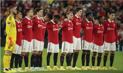  ?? Photograph: Dave Thompson/AP ?? Manchester United players observe a minute’s silence at Old Trafford on Thursday. Premier League clubs have raised concern over a possible fixture pile-up.