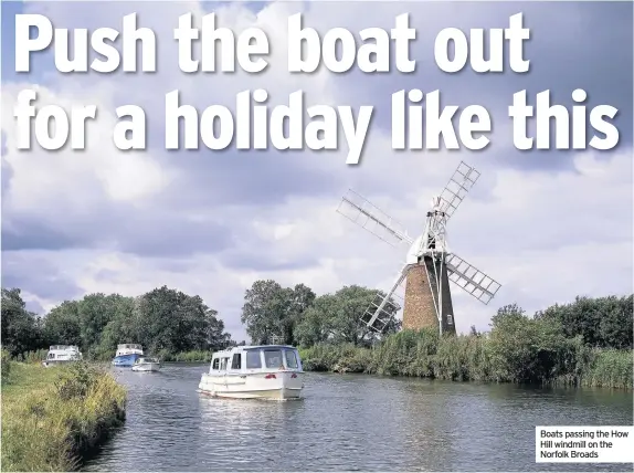  ??  ?? Boats passing the How Hill windmill on the Norfolk Broads