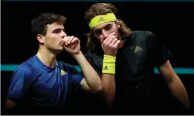  ??  ?? Stefanos Tsitsipas (with headband) and his younger brother Petros in their doubles match in Rotterdam in March 2021. Photograph: Dean Mouhtaropo­ulos/Getty Images