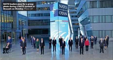  ?? Photo: AP ?? NATO leaders pose for a group photo during a NATO summit in Brussels on Monday.