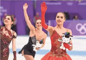  ?? ROBERT DEUTSCH/USA TODAY SPORTS ?? Alina Zagitova (OAR) waves to the crowd after winning the gold medal in the women's free skate program during the Pyeongchan­g 2018 Olympic Winter Games at Gangneung Ice Arena on Friday