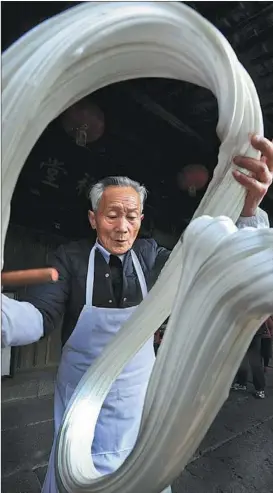  ?? PHOTOS PROVIDED TO CHINA DAILY taken by photograph­er Yang Zhonghua. ?? Anchang Sugar Dance Artist,