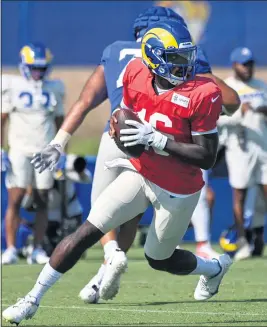  ?? PHOTO BY MICHAEL OWEN BAKER ?? The Rams face a difficult decision to keep or cut quarterbac­k Bryce Perkins. If he makes the team, he will be a third-stringer behind Matthew Stafford and John Wolford.