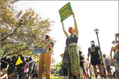  ?? Christian Abraham / Hearst Connecticu­t Media ?? Over 1,000 people gathered to protest police brutality and hear calls for peace among deepening racial tensions in the aftermath of the death of George Floyd in police custody in Minneapoli­s during a rally held on the Trumbull Green in Trumbull on Saturday.