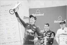  ?? ANDY WONG THE ASSOCIATED PRESS ?? Red Bull driver Daniel Ricciardo of Australia celebrates in Shanghai.