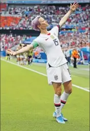  ?? Richard Heathcote Getty Images ?? MEGAN RAPINOE celebrates Sunday after scoring the first goal in the FIFA Women’s World Cup final.