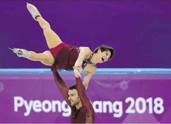  ?? LEAH HENNEL ?? Meagan Duhamel and Eric Radford compete in the pair free skating event at the Gangneung Ice Arena on Thursday. The pair won bronze.