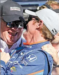  ?? AP/MICHAEL CONROY ?? Indianapol­is 500 pole-sitter Scott Dixon (right) accepts congratula­tions from car owner Chip Ganassi after Dixon finished the 2.5mile course in 2 minutes, 35.0630 seconds, edging Ed Carpenter for the inside spot on the first row.