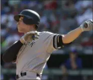  ?? LM OTERO — ASSOCIATED PRESS ?? Yankees' Aaron Judge follows the flight of his second homer of the day in the sixth inning of Sunday's game in Arlington, Texas.