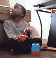  ??  ?? Ja-Mykal Dennard, 3, plays with toys during a home visit.