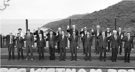  ?? REUTERS ?? Leaders pose for a group photo at the APEC economic leaders meeting in Danang, Vietnam. Russian President Vladimir Putin stands beside US President Donald Trump