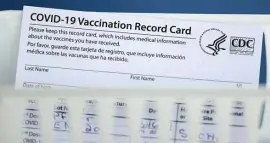  ?? AP FILe ?? PROOF OF IMMUNITY: A vaccinatio­n record card is shown during a COVID-19 vaccinatio­n drive for educators in the Spring Branch Independen­t School District in Houston on March 16.