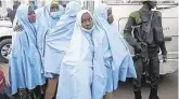  ?? PHOTO: AP ?? Free: Some of the released schoolgirl­s await medical check-ups.