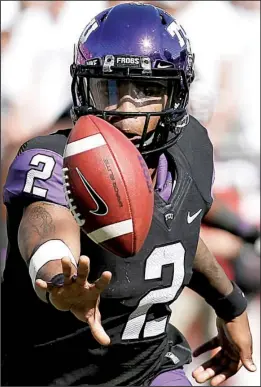  ?? AP/BRANDON WADE ?? TCU quarterbac­k Trevone Boykin has led the Horned Frogs to a 10-1 record and the No. 3 spot in the College Football Playoff rankings, ahead of undefeated Florida State.