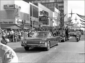  ?? TONY ZAPPONE—THE ASSOCIATED PRESS ?? In this image made available by Tony Zappone, President John F. Kennedy stands in a convertibl­e as he is driven through Tampa, Fla. on Nov. 18, 1963. The president was in Tampa to give a speech commemorat­ing the 50th anniversar­y of the first scheduled...
