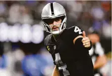  ?? Chris Unger / Getty Images ?? Raiders quarterbac­k Derek Carr will compete in his first playoff game against the Bengals on Saturday.