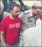  ?? HT PHOTO ?? Police bringing Harbhajan Suman to a local court in Phagwara on Monday.
