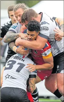  ?? Picture: STEPHEN GAUNT ?? NO WAY THROUGH: Broncos’ Dixon runs into the Wolfpack