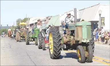  ?? ?? The 2023 Clotheslin­e Parade had about 140 entries, including many farm tractors, classic vehicles, area businesses, square dance groups, horses and fire trucks.